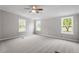 Spacious bedroom with ceiling fan and three large windows at 262 Homestead Dr, Selma, NC 27576