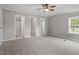 Primary bedroom with ceiling fan and access to bathroom and closet at 262 Homestead Dr, Selma, NC 27576