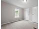 Bright bedroom with large window and closet at 262 Homestead Dr, Selma, NC 27576
