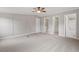 Primary bedroom with ceiling fan and access to two bathrooms at 262 Homestead Dr, Selma, NC 27576