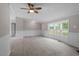 Dining area with wood-look floors, wainscoting, and access to deck at 262 Homestead Dr, Selma, NC 27576
