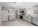 Modern kitchen with gray cabinets, stainless steel appliances, and granite counters at 262 Homestead Dr, Selma, NC 27576