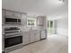 Modern kitchen with stainless steel appliances and access to deck at 262 Homestead Dr, Selma, NC 27576