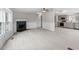 Open living room with fireplace, wood-look flooring, and ample natural light at 262 Homestead Dr, Selma, NC 27576