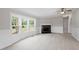 Bright living room featuring a fireplace and large windows at 262 Homestead Dr, Selma, NC 27576