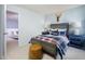 Bedroom with a wooden bed frame and a view into another room at 2786 Farmhouse Dr, Apex, NC 27502