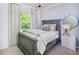 Cozy bedroom with a gray bed frame and a view of the backyard at 2786 Farmhouse Dr, Apex, NC 27502