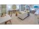 Spacious bonus room with a comfortable couch and a workspace at 2786 Farmhouse Dr, Apex, NC 27502