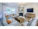 Spacious living room with fireplace and large TV at 2786 Farmhouse Dr, Apex, NC 27502