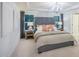 Main bedroom with a tufted headboard and ensuite bath at 2786 Farmhouse Dr, Apex, NC 27502
