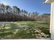 Large backyard with grassy area and mature trees at 359 Magnolia Run Way, Benson, NC 27504