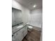Clean bathroom with a tub, shower, and granite vanity at 359 Magnolia Run Way, Benson, NC 27504