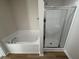 Bathroom features a soaking tub and a separate shower stall at 359 Magnolia Run Way, Benson, NC 27504