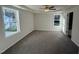 Spacious bedroom with carpet, ceiling fan, and large windows at 359 Magnolia Run Way, Benson, NC 27504