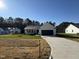 Newly constructed home with a two-car garage and landscaped yard at 359 Magnolia Run Way, Benson, NC 27504