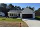 New construction home features a neutral color palette and a two-car garage at 359 Magnolia Run Way, Benson, NC 27504