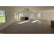 Open living room with a fireplace and hardwood floors at 359 Magnolia Run Way, Benson, NC 27504