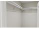 Walk-in closet with double hanging rods and shelving at 4075 Elk Creek Ln # 9, Raleigh, NC 27612