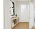 Bright and airy entryway with wood console table at 4075 Elk Creek Ln # 9, Raleigh, NC 27612