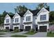 Four modern townhouses with attached garages and landscaping at 4075 Elk Creek Ln # 9, Raleigh, NC 27612