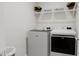 Laundry room with washer, dryer, and shelving for storage at 4075 Elk Creek Ln # 9, Raleigh, NC 27612