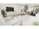 Bright living room with comfy seating and large TV at 4075 Elk Creek Ln # 9, Raleigh, NC 27612
