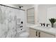 Modern bathroom with a shower, vanity, and sleek black fixtures, offering a clean and contemporary design at 4077 Elk Creek Ln, Raleigh, NC 27612