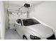 Spacious garage featuring a white car and automatic door opener, providing convenient parking at 4077 Elk Creek Ln, Raleigh, NC 27612