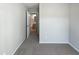 Bedroom with carpet and door to bathroom at 5211 Blue Lagoon Ln, Raleigh, NC 27610