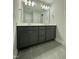 Modern bathroom with double vanity and large mirror at 554 Eversden Dr, Zebulon, NC 27597