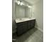 Modern bathroom with double vanity and dark cabinets at 554 Eversden Dr, Zebulon, NC 27597