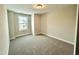 Spacious bedroom with carpeted floors and a window at 554 Eversden Dr, Zebulon, NC 27597