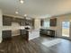 Modern kitchen featuring gray cabinets and granite island at 554 Eversden Dr, Zebulon, NC 27597