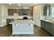 Kitchen island with granite countertop and white base at 554 Eversden Dr, Zebulon, NC 27597