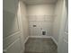 Laundry room with tile floor and shelving at 554 Eversden Dr, Zebulon, NC 27597