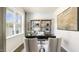 Home office with a desk, wooden shelves, and large window at 70 Saddle Mare St, Clayton, NC 27520