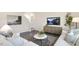 Living room with sectional sofa, coffee table, and TV stand at 70 Saddle Mare St, Clayton, NC 27520