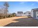 Large backyard with grassy area, offering plenty of space for recreation at 88 Capewood Ct, Garner, NC 27529