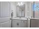 Bathroom with white vanity, quartz countertop and mirror at 88 Capewood Ct, Garner, NC 27529