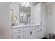 Bathroom with white cabinets, quartz countertop and linen closet at 88 Capewood Ct, Garner, NC 27529