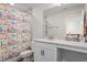 Bathroom with white vanity and patterned shower curtain at 88 Capewood Ct, Garner, NC 27529