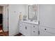 Bathroom with white cabinets, quartz countertop and linen closet at 88 Capewood Ct, Garner, NC 27529