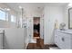 Modern bathroom with a glass shower, herringbone tile, and double vanity at 88 Capewood Ct, Garner, NC 27529