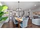 Open concept dining room with hardwood floors and chandelier at 88 Capewood Ct, Garner, NC 27529