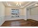 Bright dining room with hardwood floors and wainscoting at 88 Capewood Ct, Garner, NC 27529