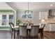 Bright dining room with hardwood floors and a chandelier at 88 Capewood Ct, Garner, NC 27529