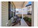 Front porch with two wooden chairs and landscaping at 88 Capewood Ct, Garner, NC 27529