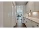 Bright hallway connecting kitchen to dining and living areas at 88 Capewood Ct, Garner, NC 27529