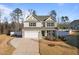Two story house with a two-car garage and landscaping at 88 Capewood Ct, Garner, NC 27529