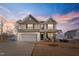 Two story house with a two-car garage and landscaping at 88 Capewood Ct, Garner, NC 27529